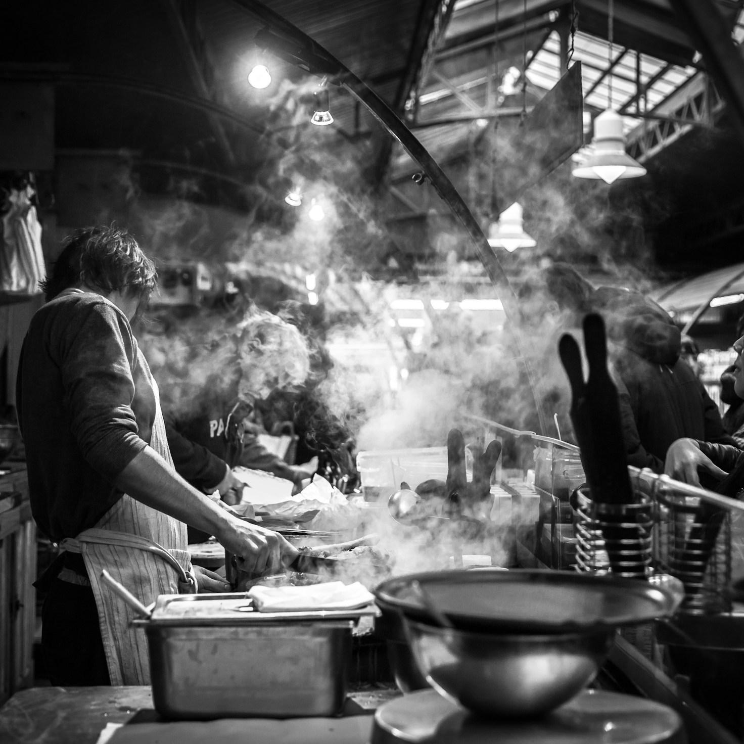 Diverse community members sharing a meal, highlighting bonds formed through collaborative cooking